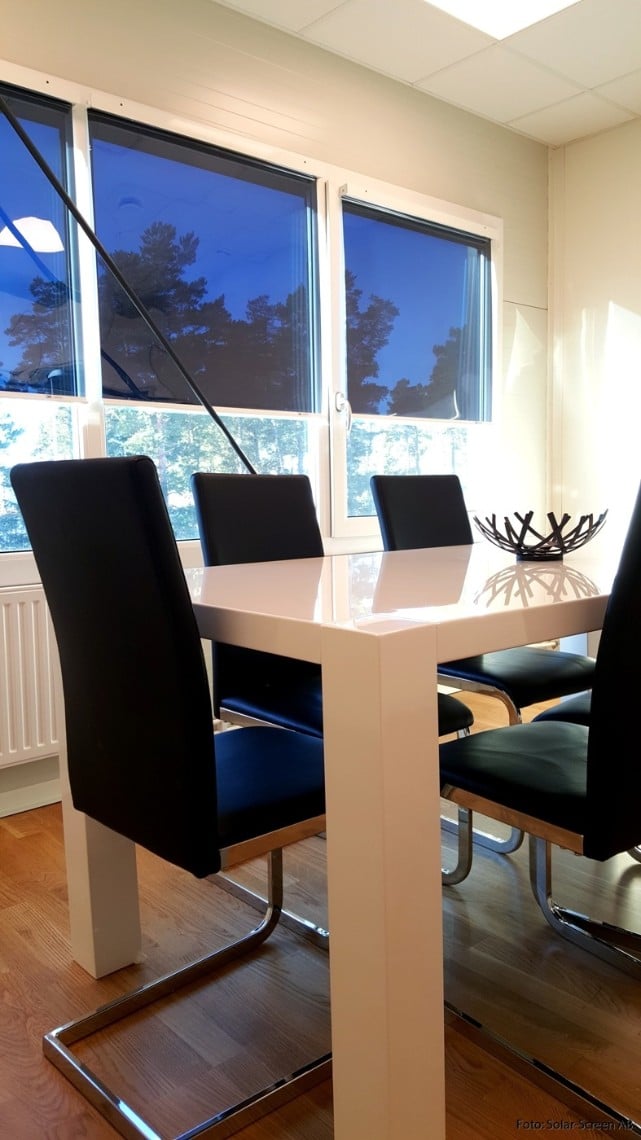 Diningroom with solar screen roller blinds in windows