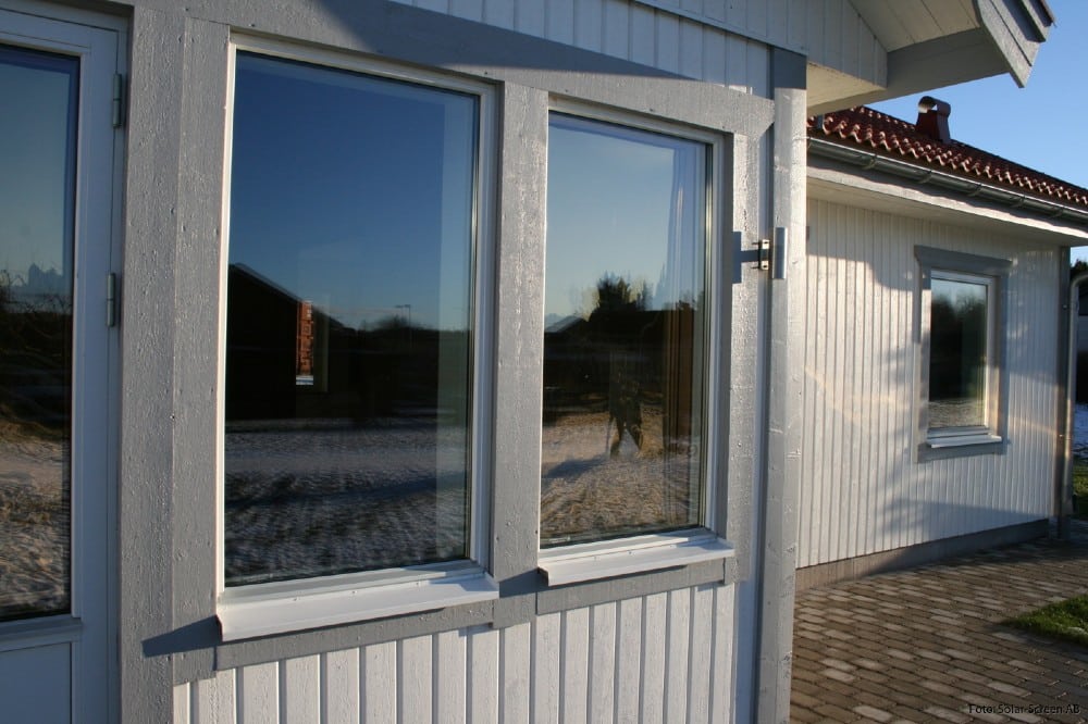 House with solar shades roller blinds